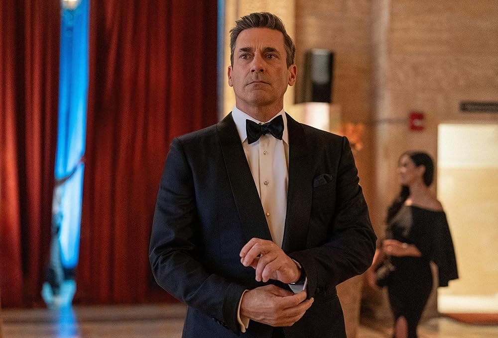 Jon Hamm dressed in a tuxedo in a ballroom in the TV show, Your Friends & Neighbors - Filmotomy