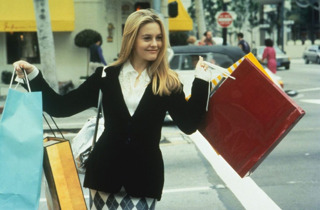 Cher clutches multiple shopping bags in Clueless (1995) - Filmotomy 